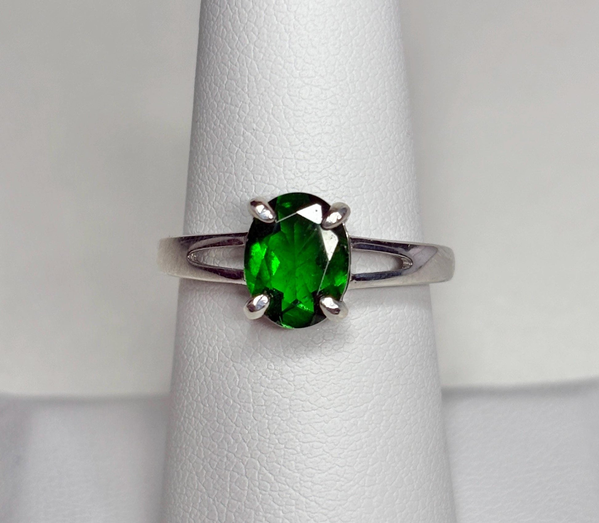 Sterling silver ring with an oval chrome diopside gemstone.