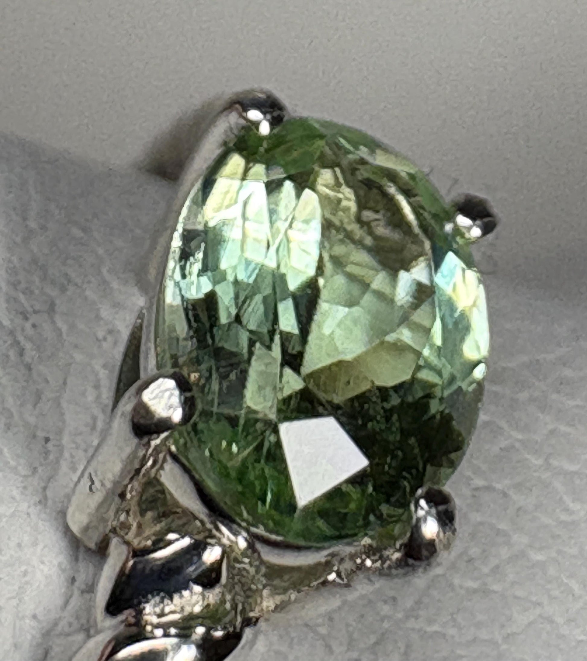 Sterling silver ring with an oval, east-west set green tourmaline.