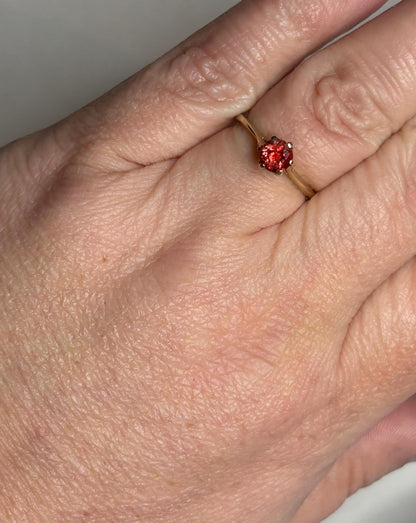 Red Oregon Sunstone solitaire ring in 10k gold.