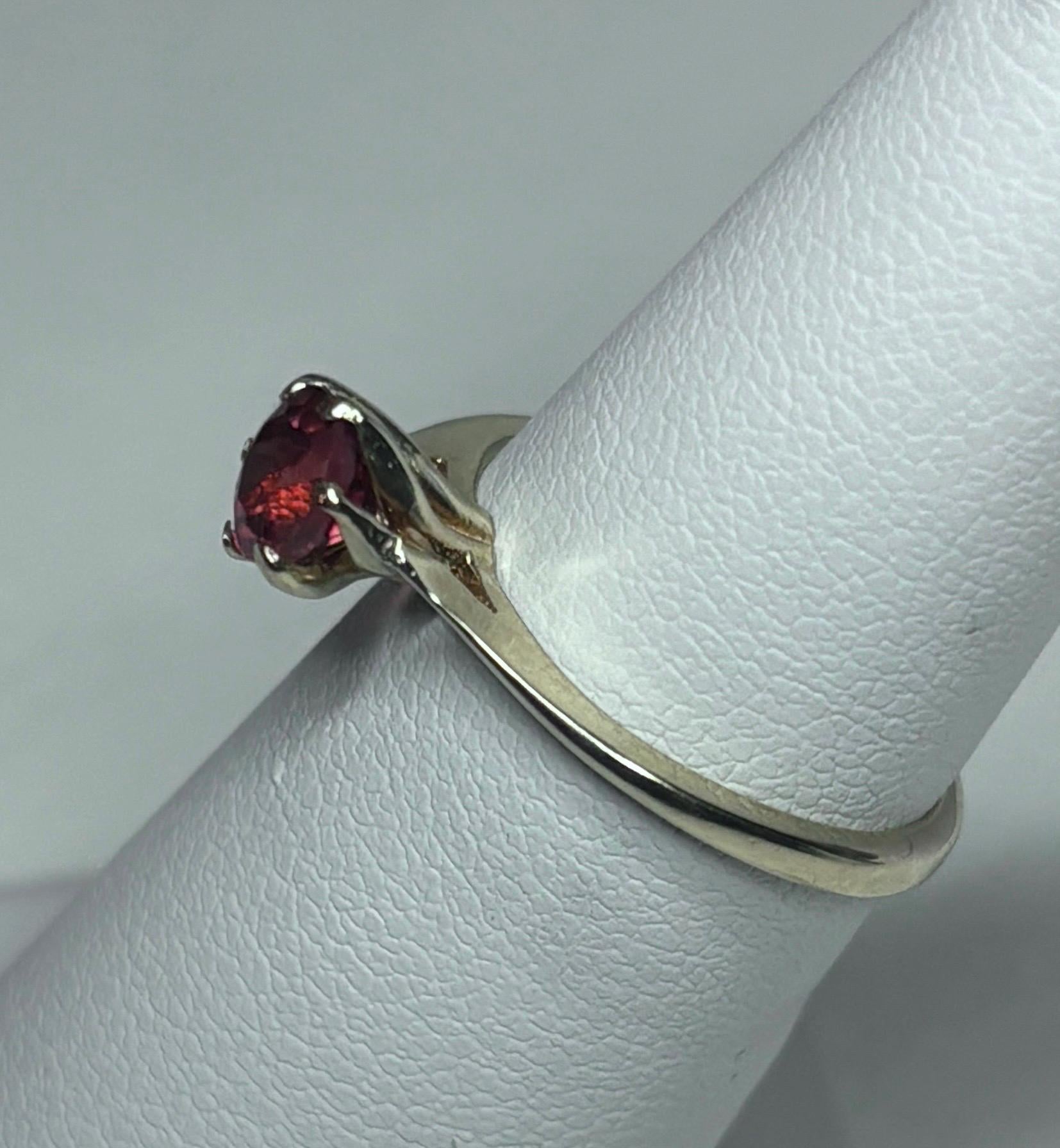 A 10k gold ring with a round red Oregon sunstone.