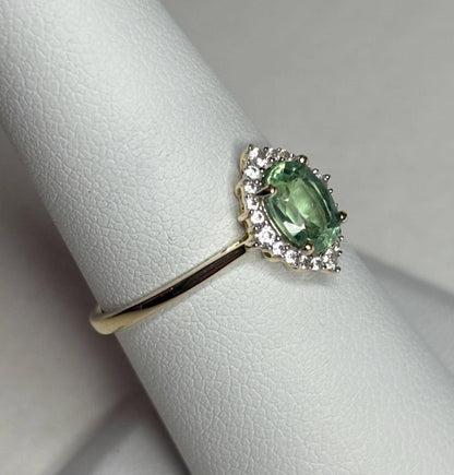 Mint green kyanite and zircon halo ring in solid 9k gold.