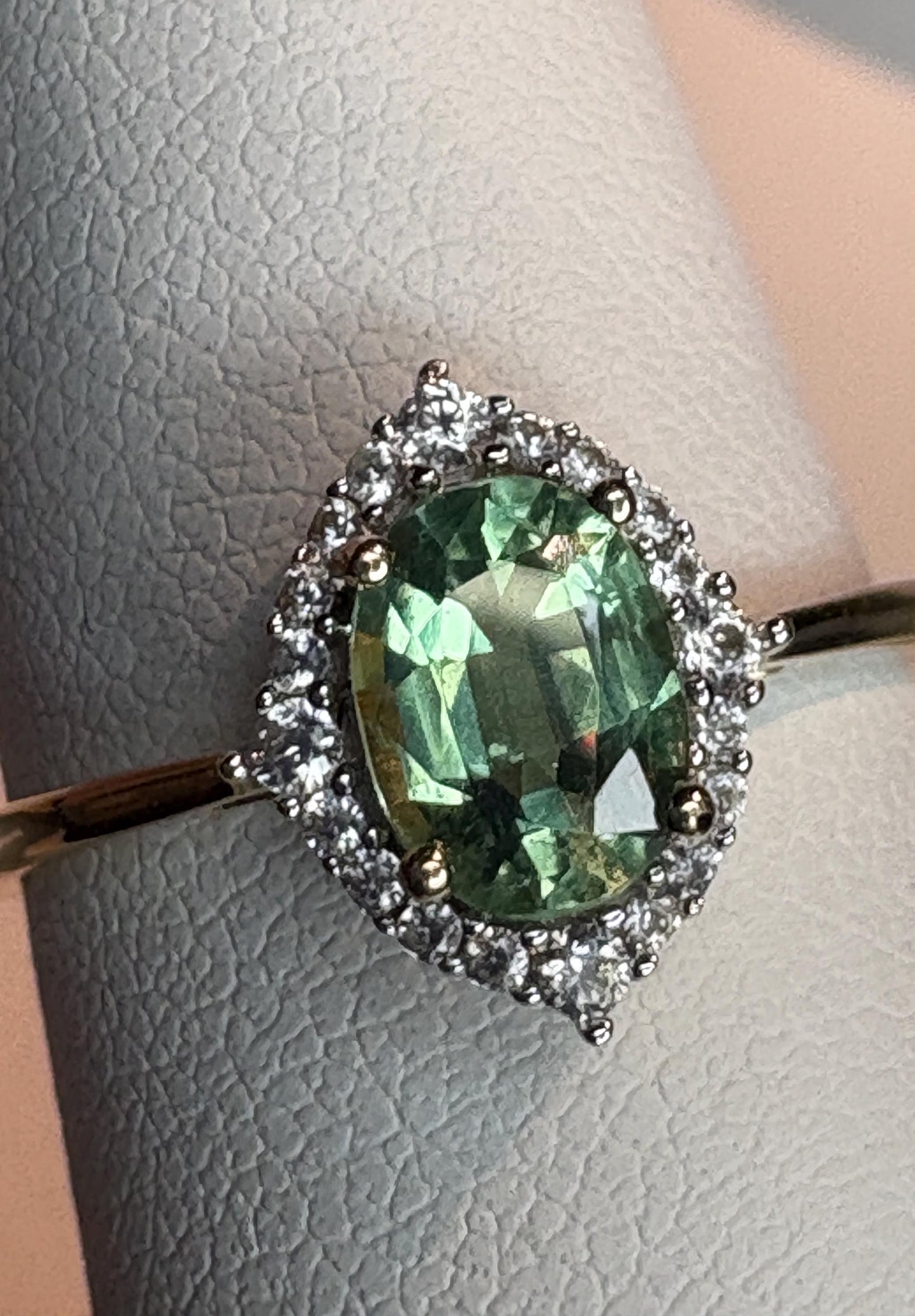 Mint green kyanite and zircon halo ring in solid 9k gold.