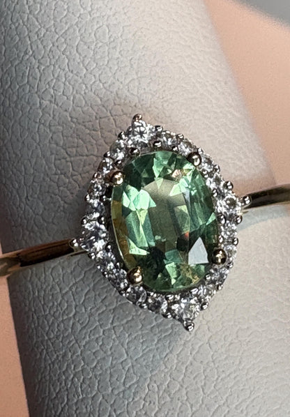 Mint green kyanite and zircon halo ring in solid 9k gold.