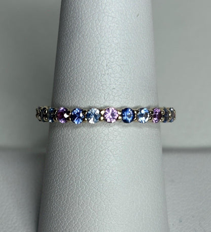 Multi-color sapphire full eternity band ring in 14k gold.