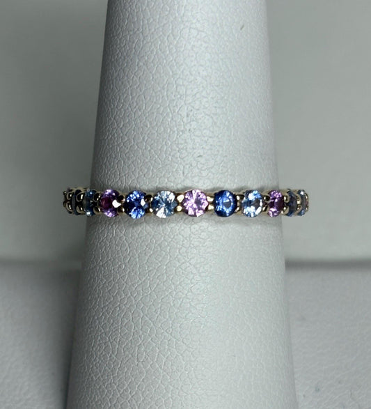 Multi-color sapphire full eternity band ring in 14k gold.