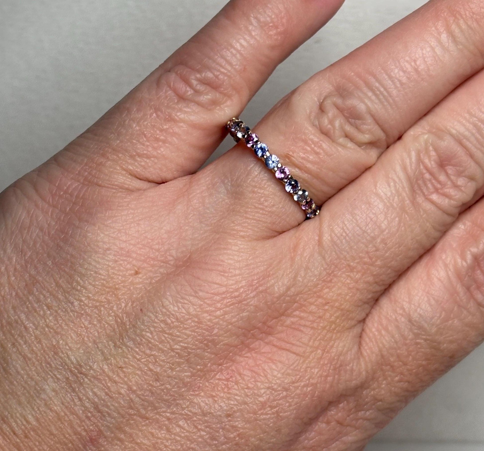 14k gold ring with multi-color natural sapphires.