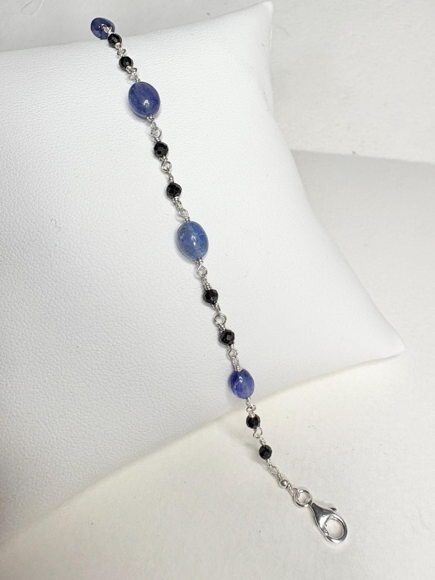 Sterling silver bracelet with black diamond and tanzanite beads.
