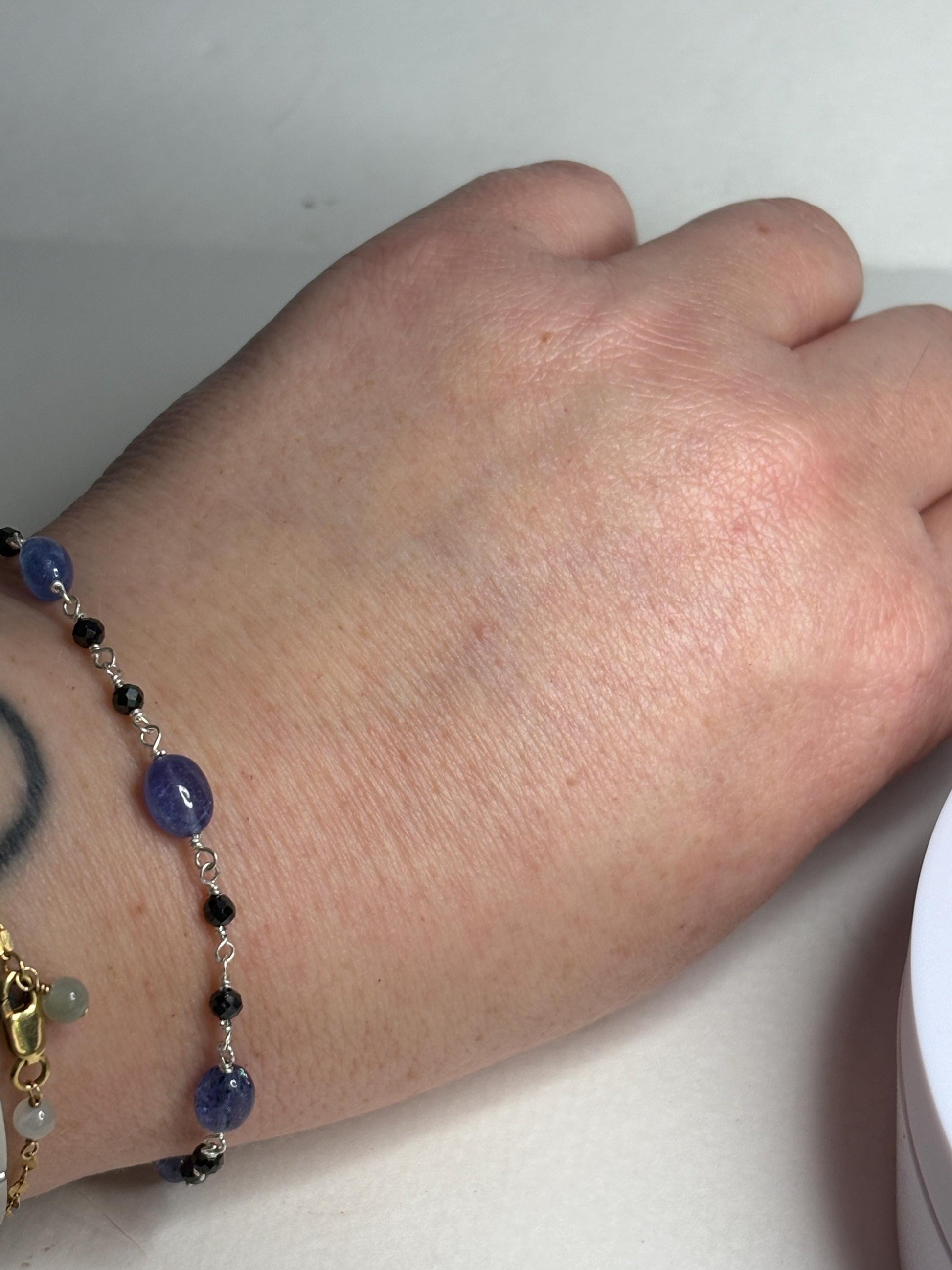 Sterling silver bracelet with black diamond and tanzanite beads.