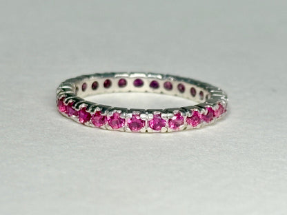 Hot pink lab-grown sapphire eternity ring in solid sterling silver.