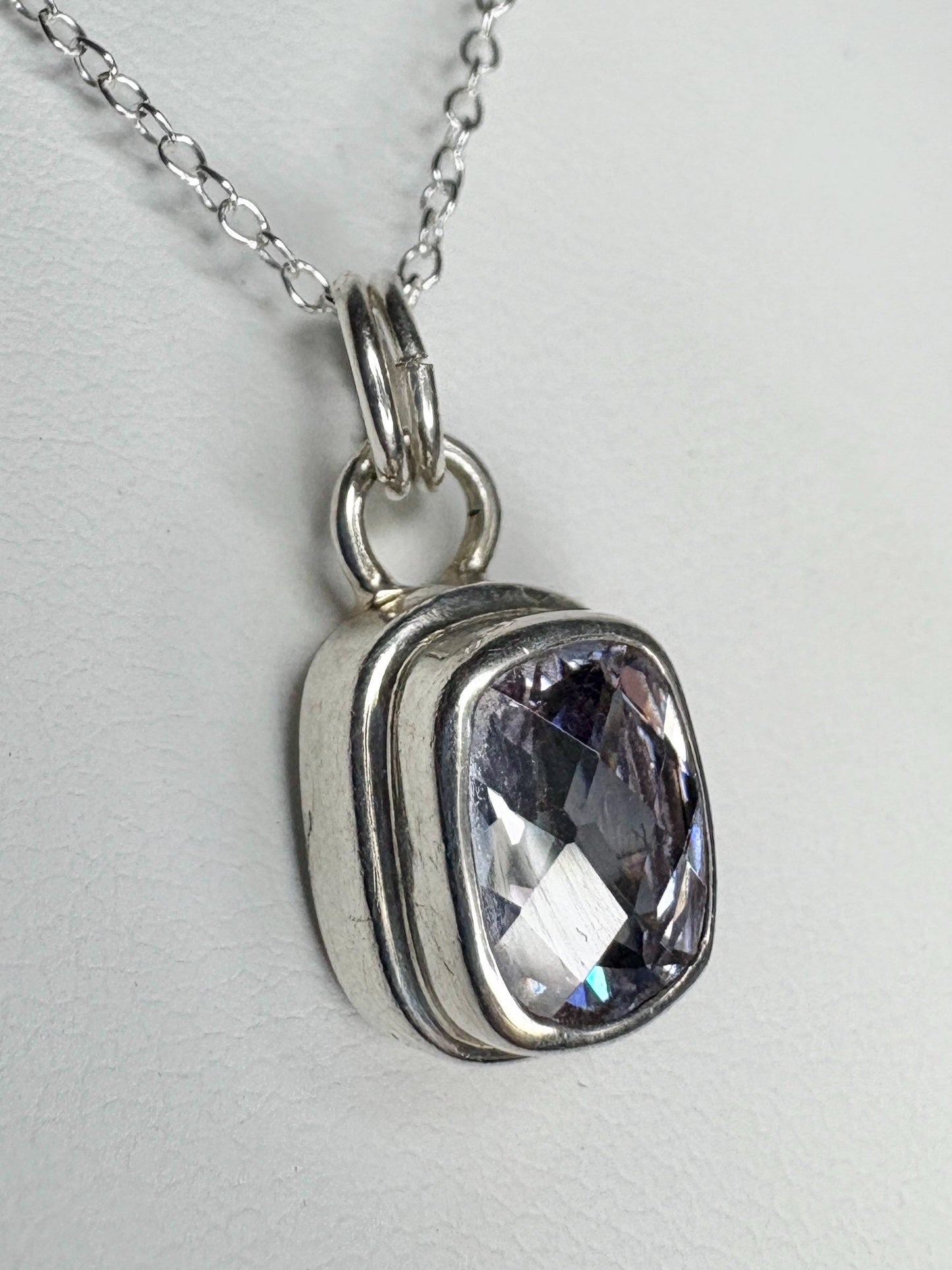 Sterling silver pendant necklace with a lavender checkerboard faceted cushion-cut CZ.