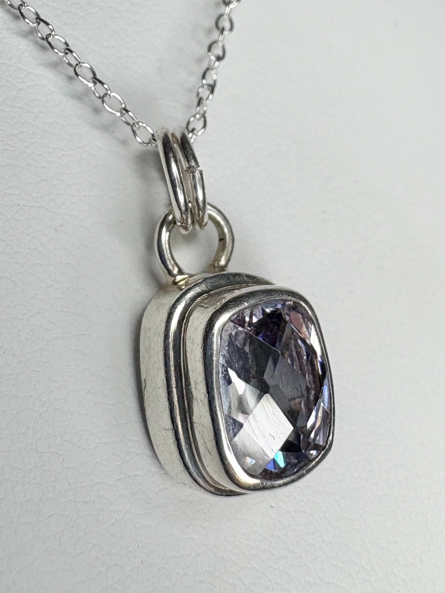 Sterling silver pendant necklace with a lavender checkerboard faceted cushion-cut CZ.