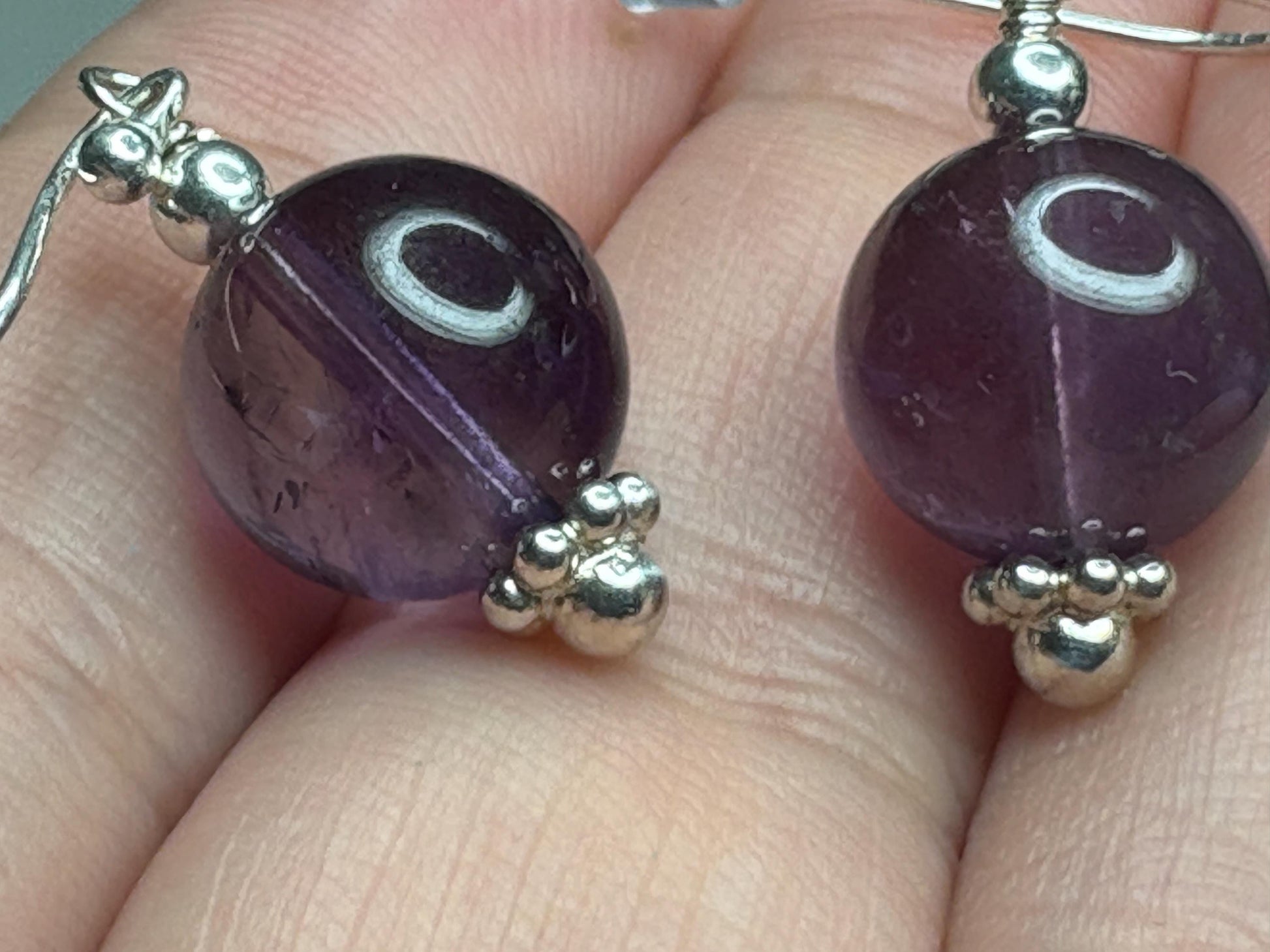Sterling silver dangle earrings with 10mm natural amethyst beads.