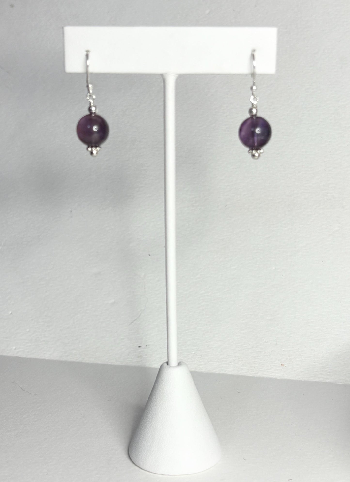 Sterling silver dangle earrings with 10mm natural amethyst beads.