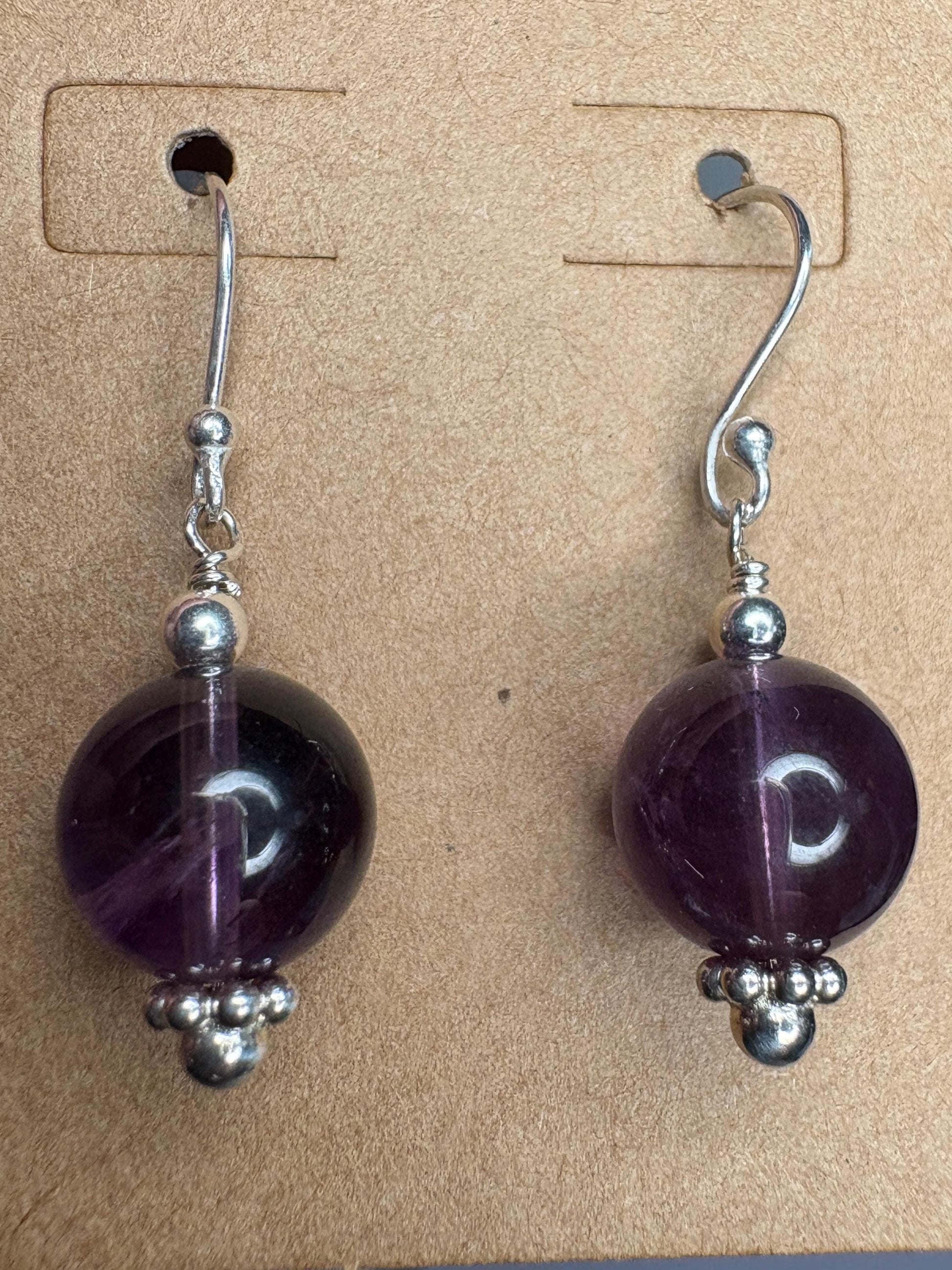 Sterling silver dangle earrings with 10mm natural amethyst beads.