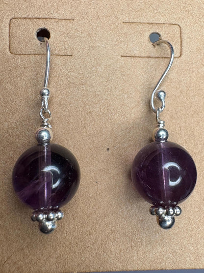 Sterling silver dangle earrings with 10mm natural amethyst beads.