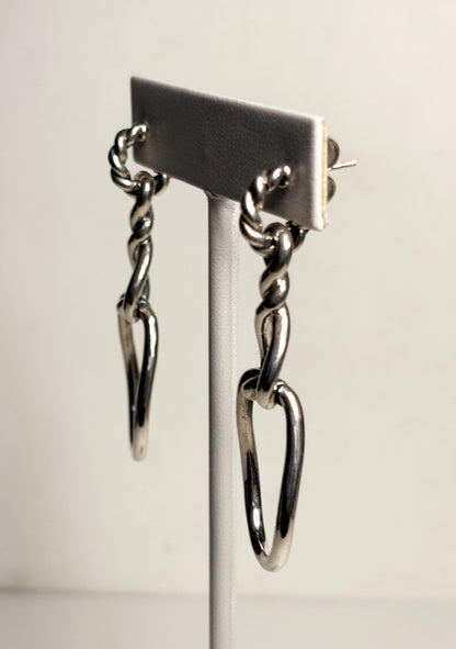 Sterling silver dangle earrings with twisted rope design and 14k gold posts.