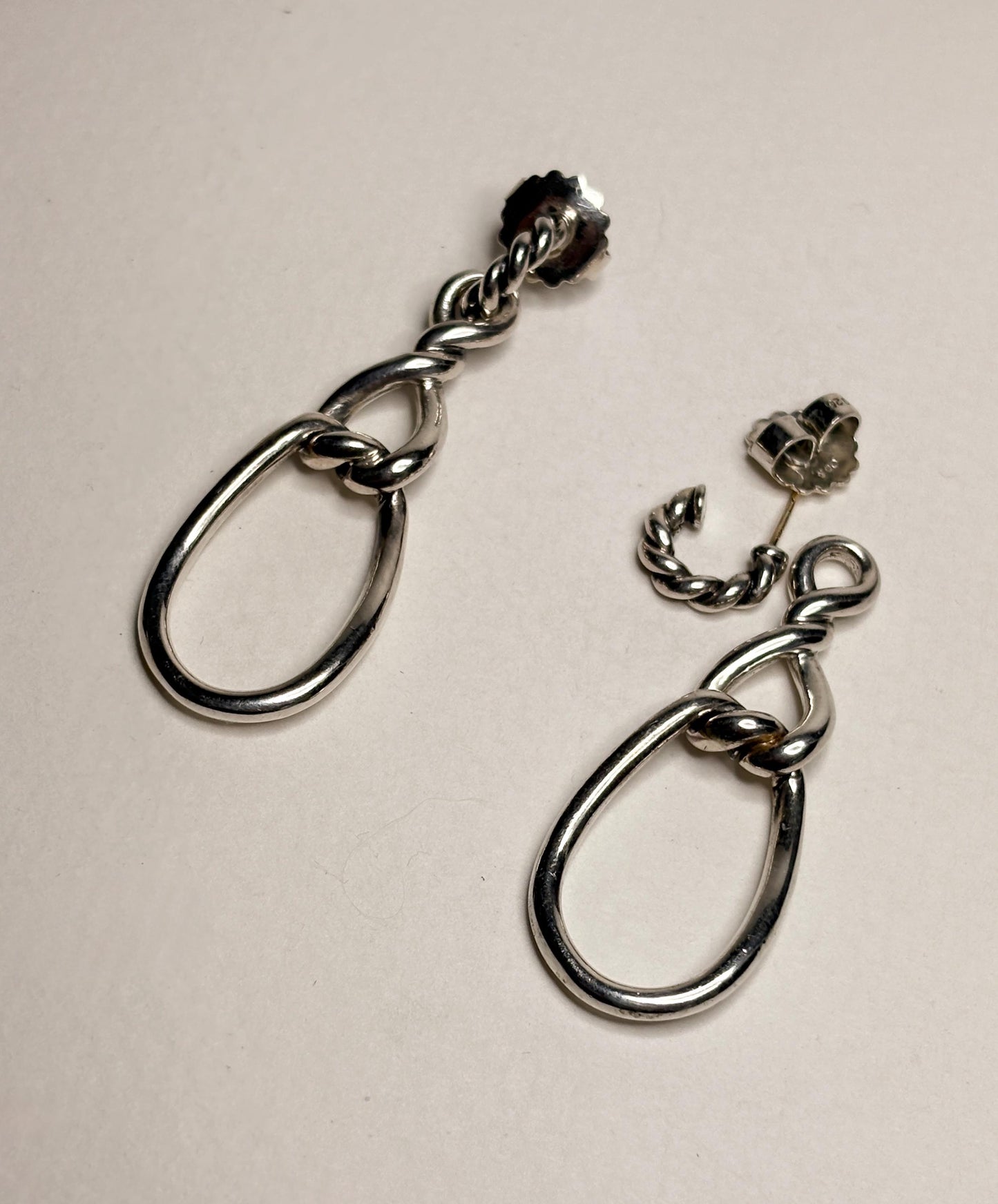Sterling silver dangle earrings with twisted rope detail and 14k gold posts.