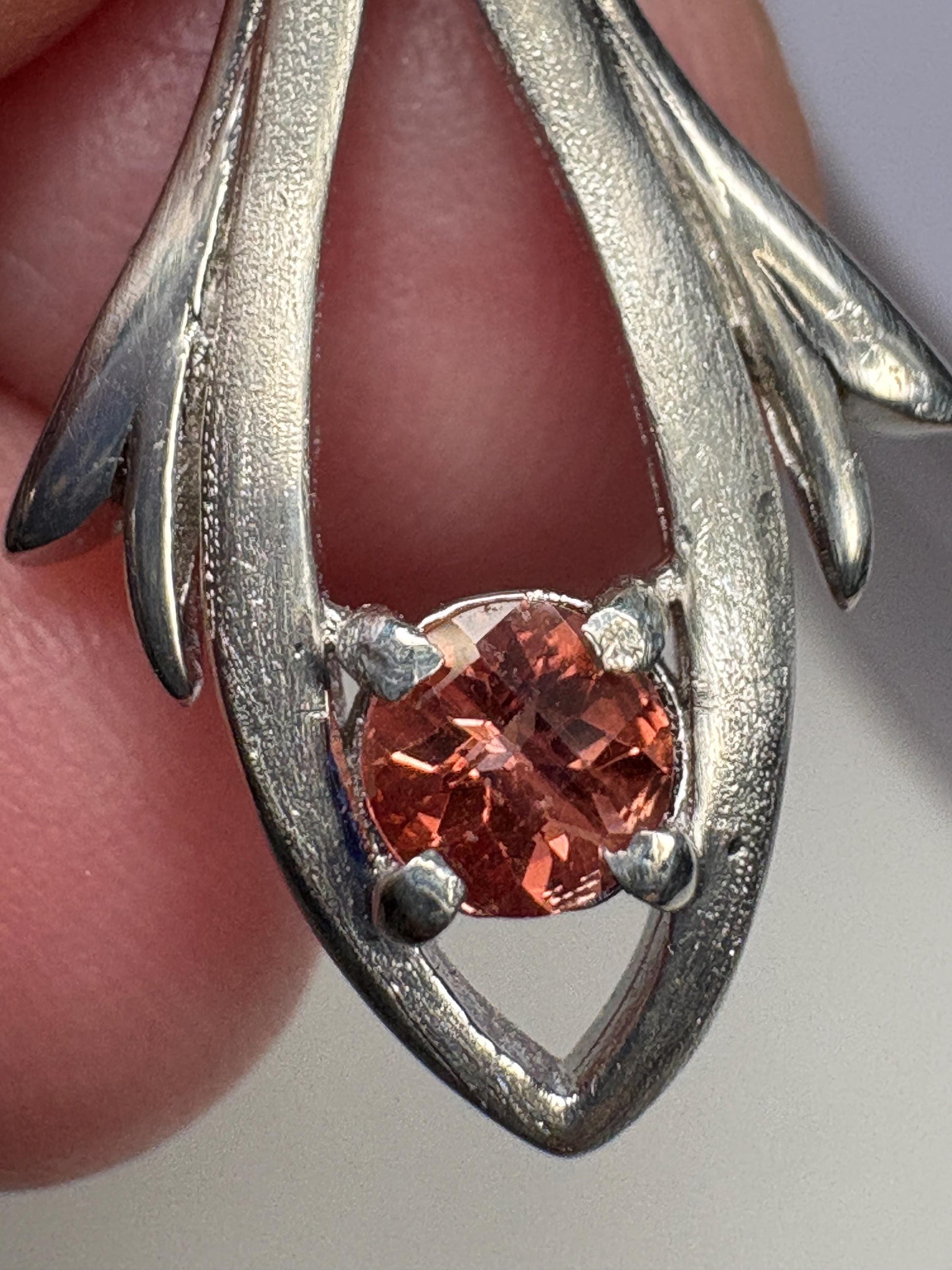 Sterling silver pendant with a light red Oregon sunstone.