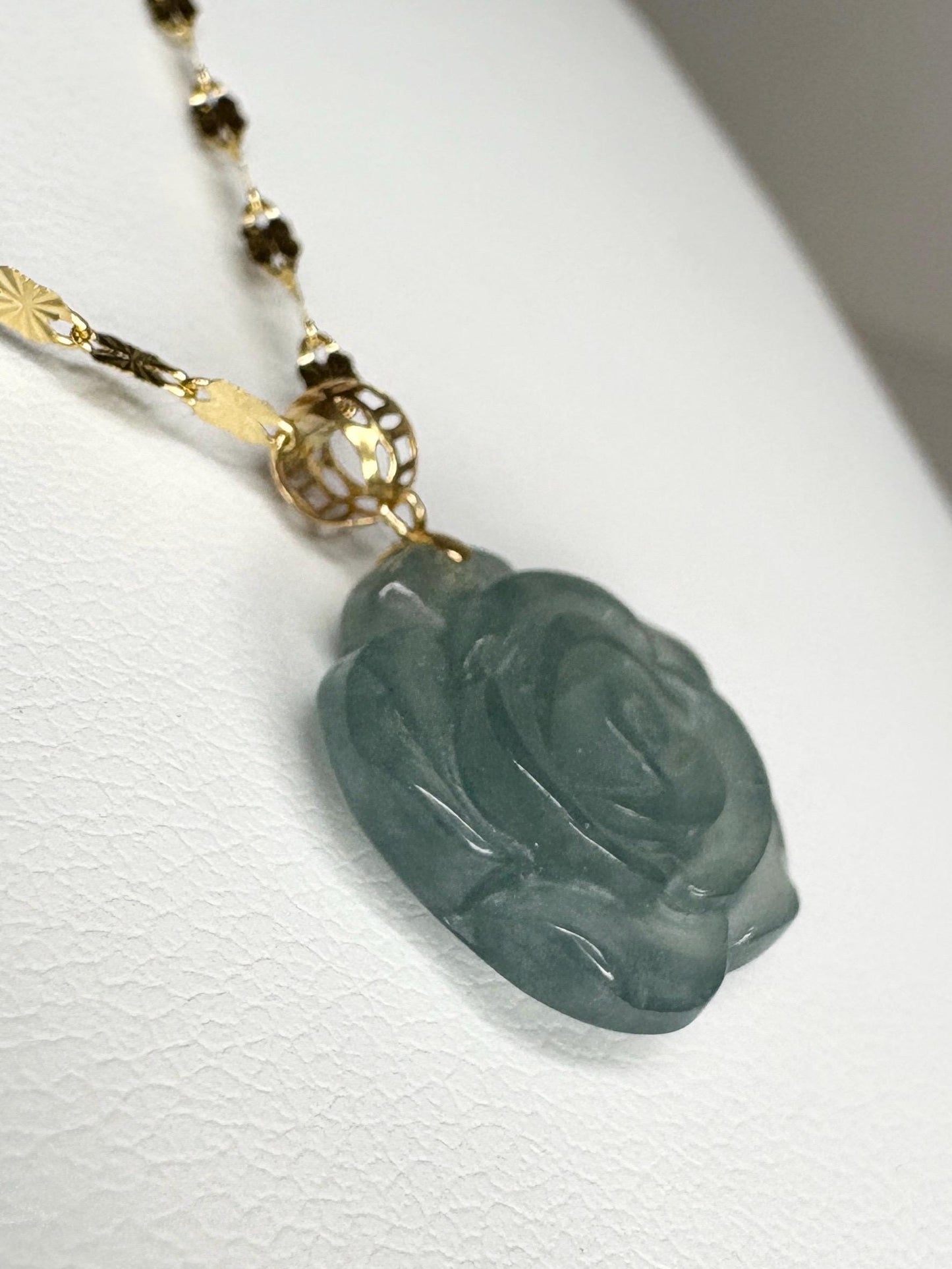 Teal jadeite jade rose pendant on an 18k gold bail and 14k gold chain.