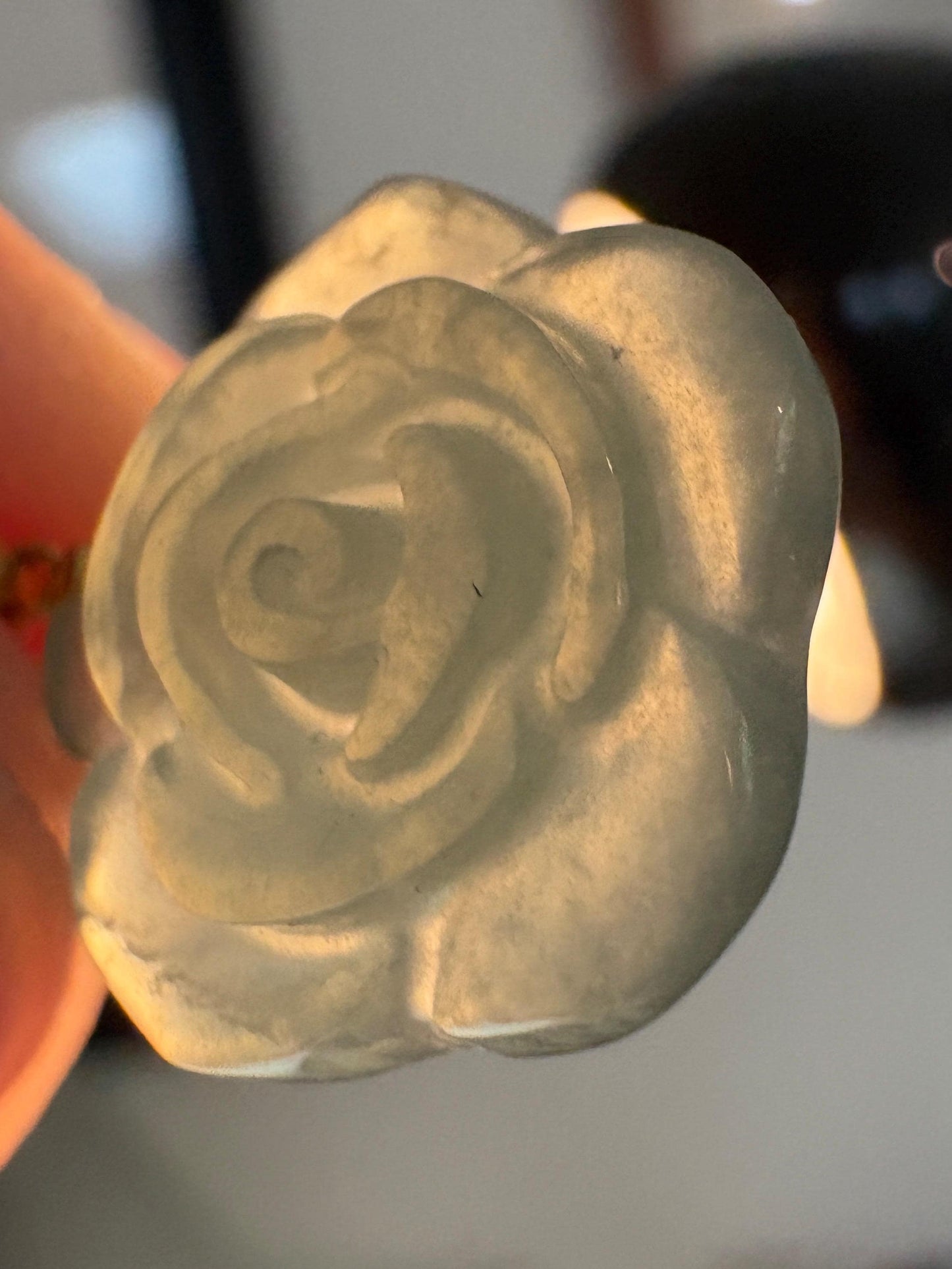 A translucent teal jadeite jade rose pendant on an 18k bail and 14k gold chain.