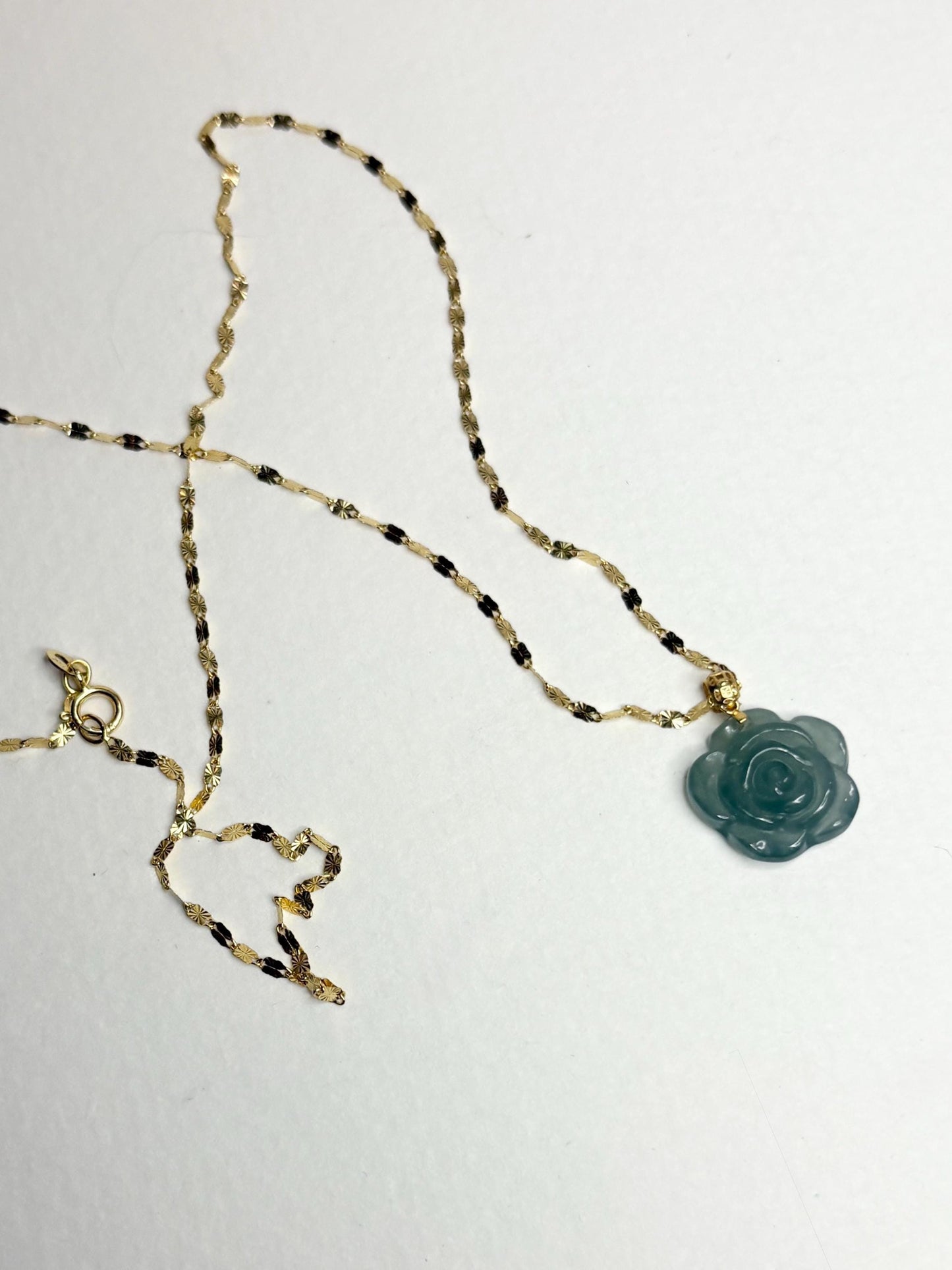 Teal jadeite jade rose pendant on a delicate 14k gold chain.