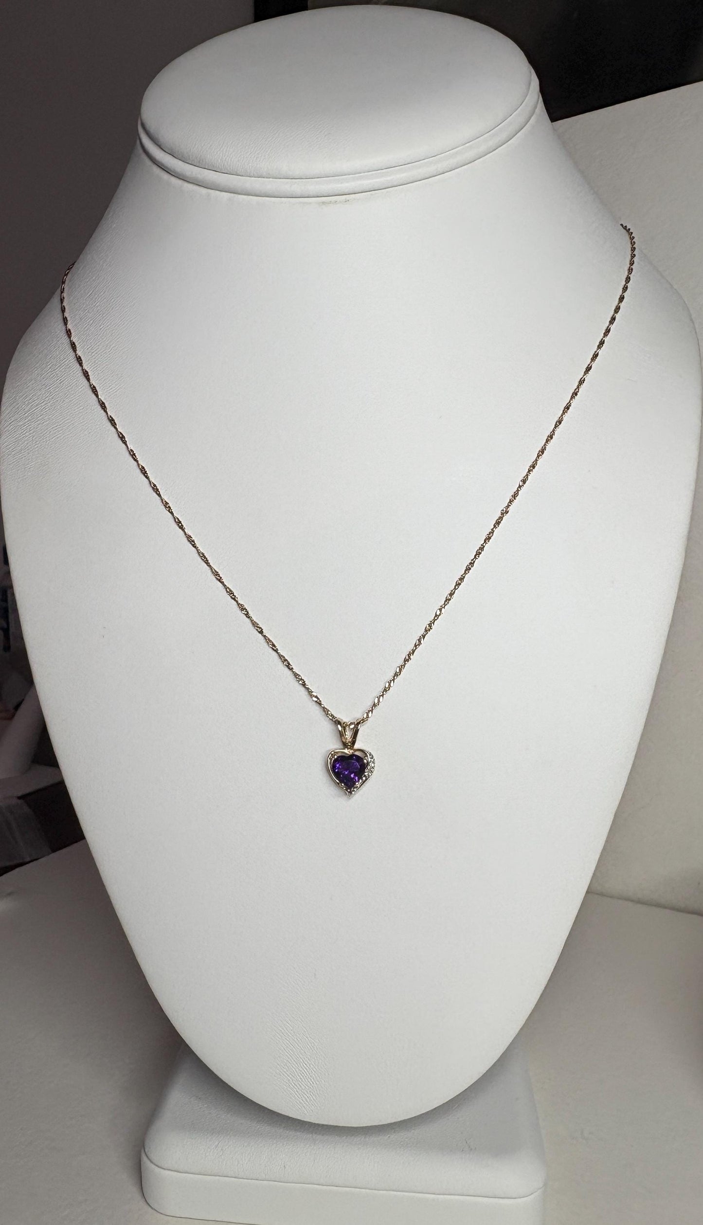 African amethyst and diamond heart pendant on a 14k gold chain.