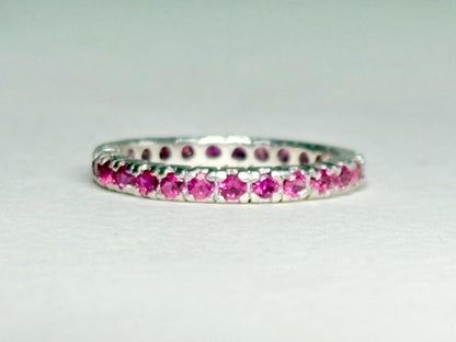 Hot pink sapphire eternity ring in sterling silver.