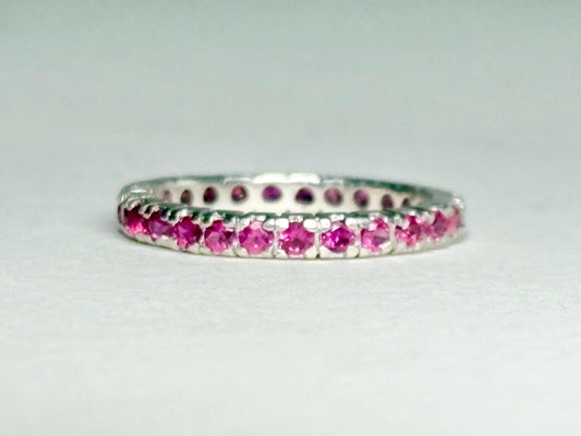 Hot pink sapphire eternity ring in sterling silver.
