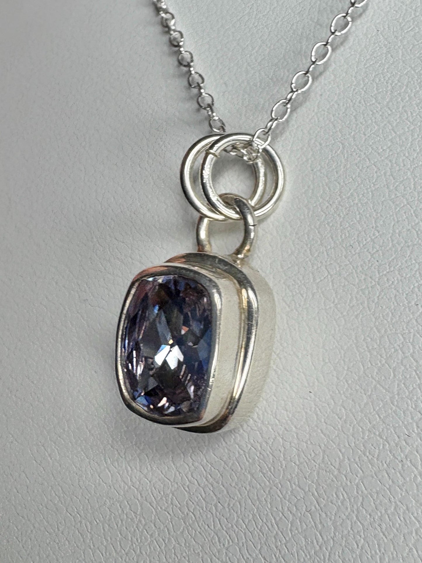 Sterling silver pendant necklace with a lavender checkerboard faceted cushion-cut CZ.