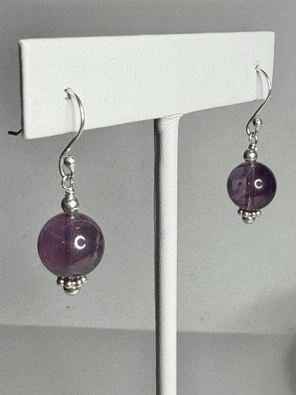 Sterling silver dangle earrings with 10mm natural amethyst beads.