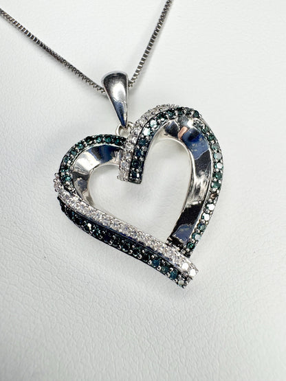 Sterling silver heart pendant necklace with blue and white diamonds.