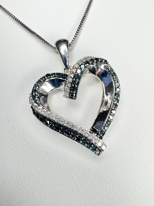Sterling silver heart pendant necklace with blue and white diamonds.