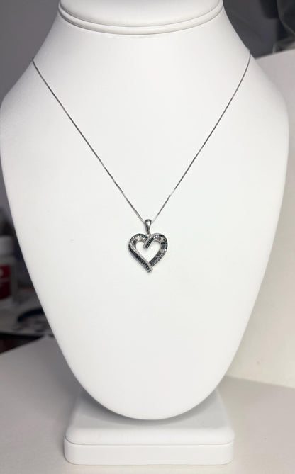 Sterling silver heart pendant necklace with blue and white diamonds.