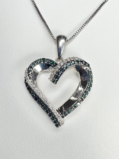 Sterling silver heart pendant necklace with blue and white diamonds.