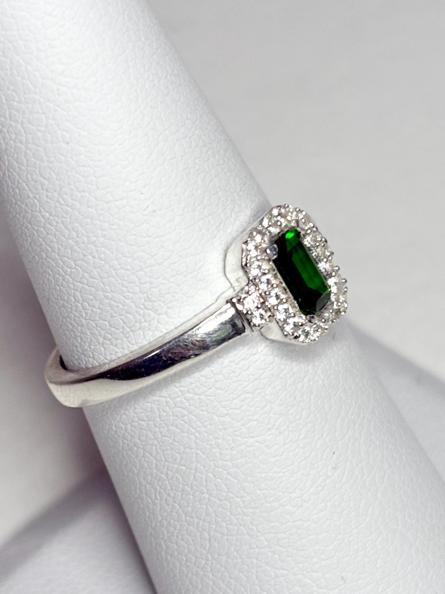 Sterling silver ring with emerald-cut chrome diopside and white zircon halo.