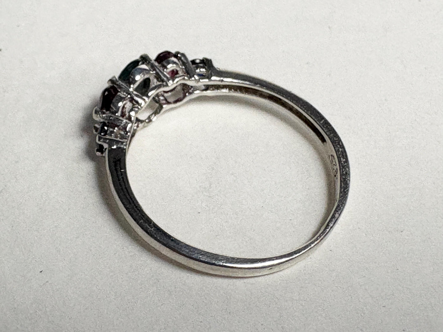 Sterling silver band ring with alexandrite, rhodolite garnets, and blue sapphires.