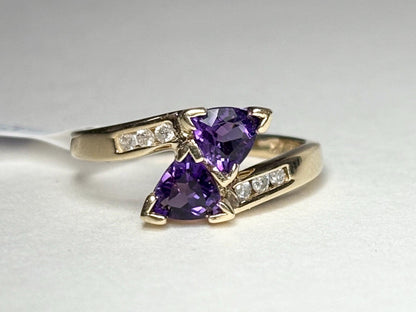 Amethyst trillion bypass ring with diamonds in solid 10k gold.
