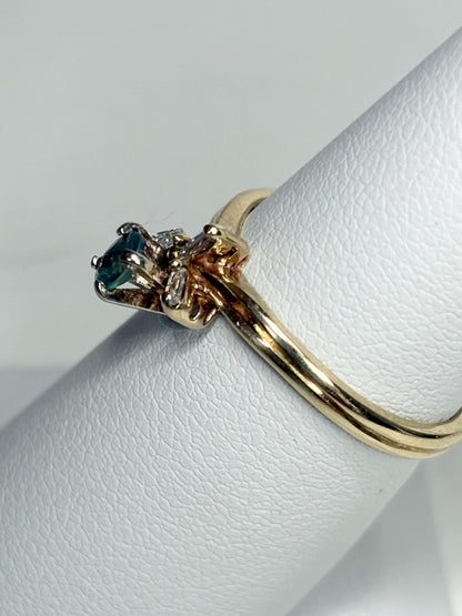 14k gold ring with oval alexandrite and baguette diamonds.