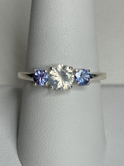 Sterling silver ring with a central off-white zircon and two tanzanite stones.