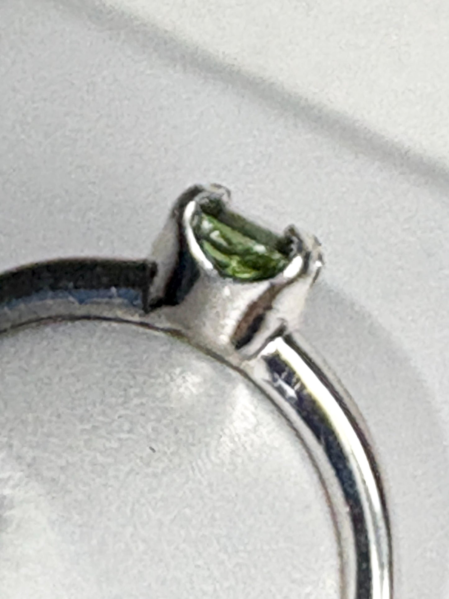 Sterling silver ring with a green tourmaline solitaire.