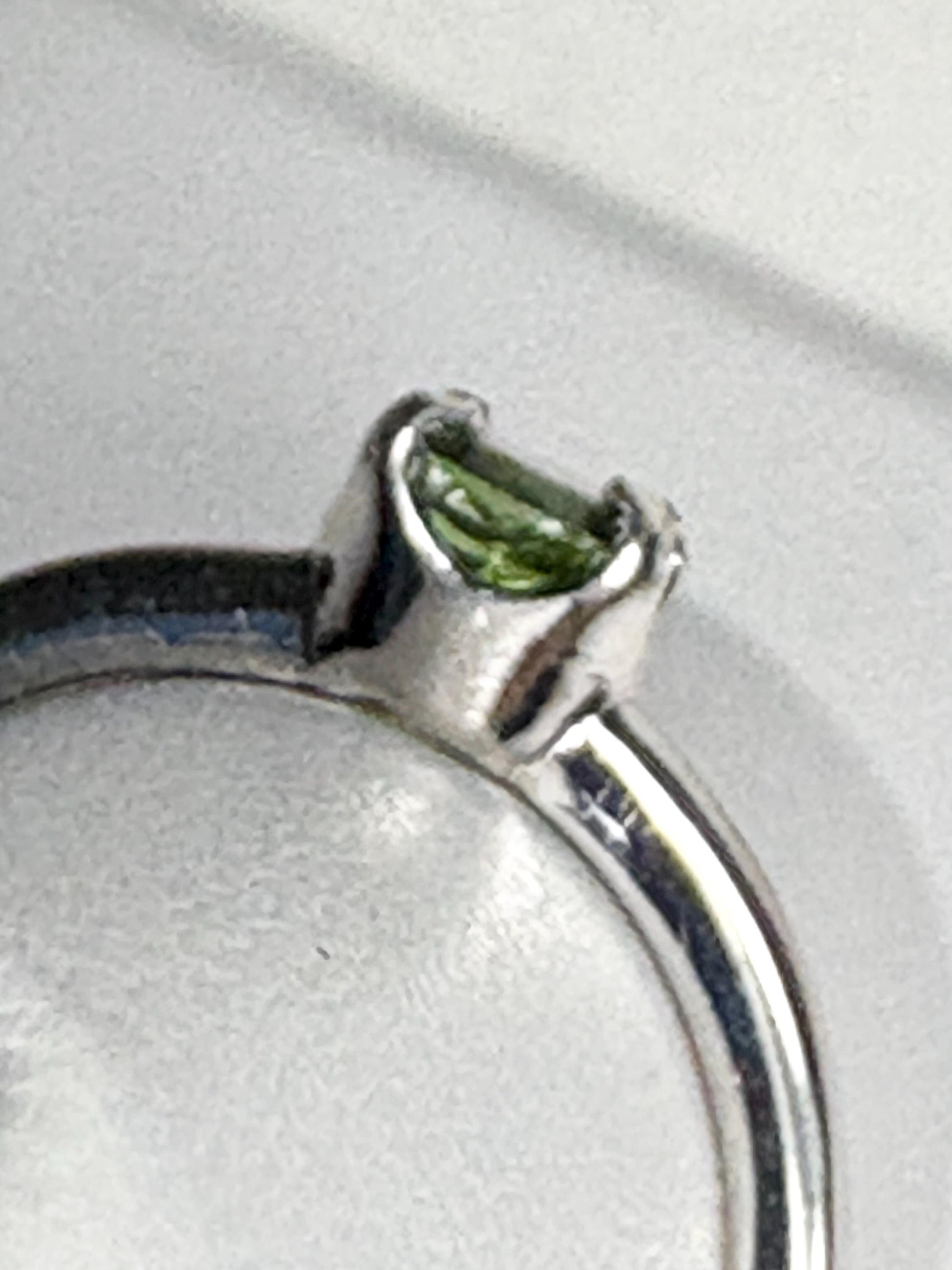 Sterling silver ring with a green tourmaline solitaire.