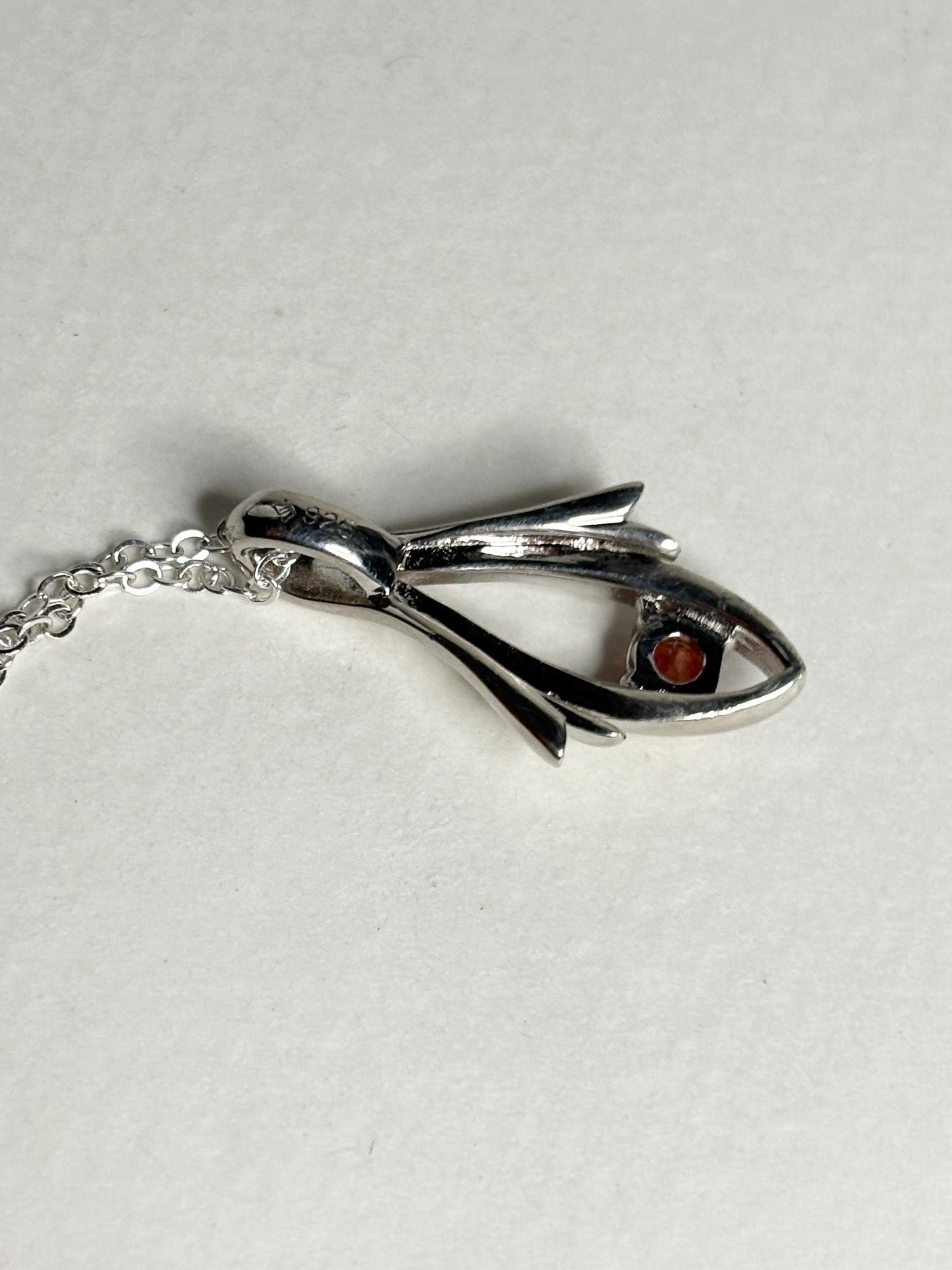 Sterling silver pendant necklace with a light red Oregon sunstone.