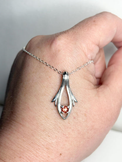 Sterling silver pendant necklace with a light red Oregon sunstone.