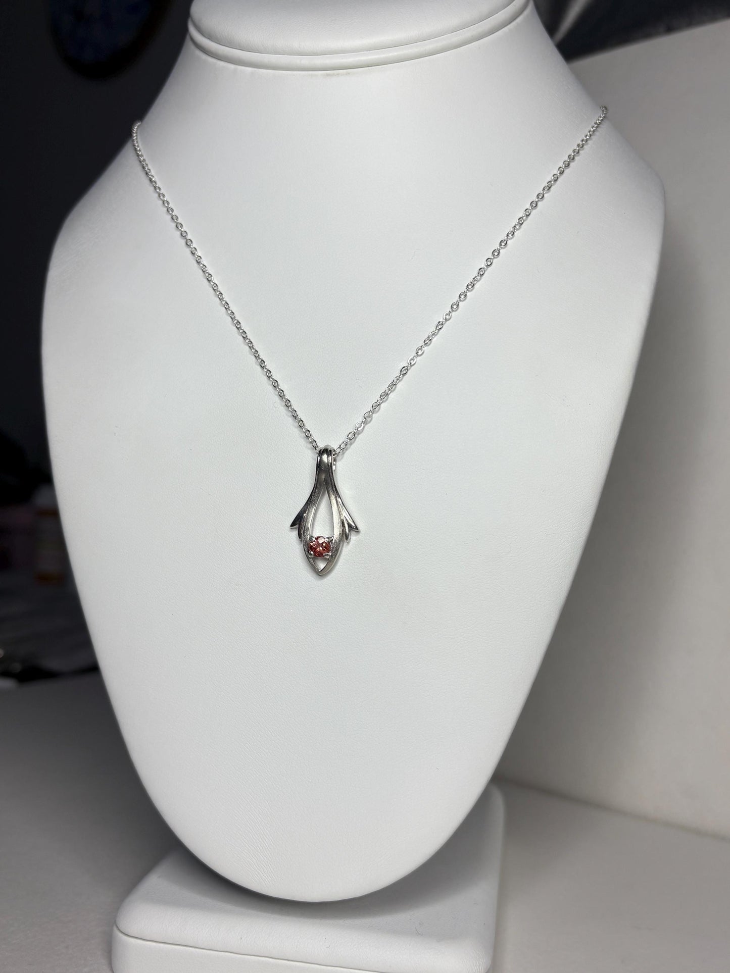 Sterling silver pendant necklace with a light red Oregon sunstone.