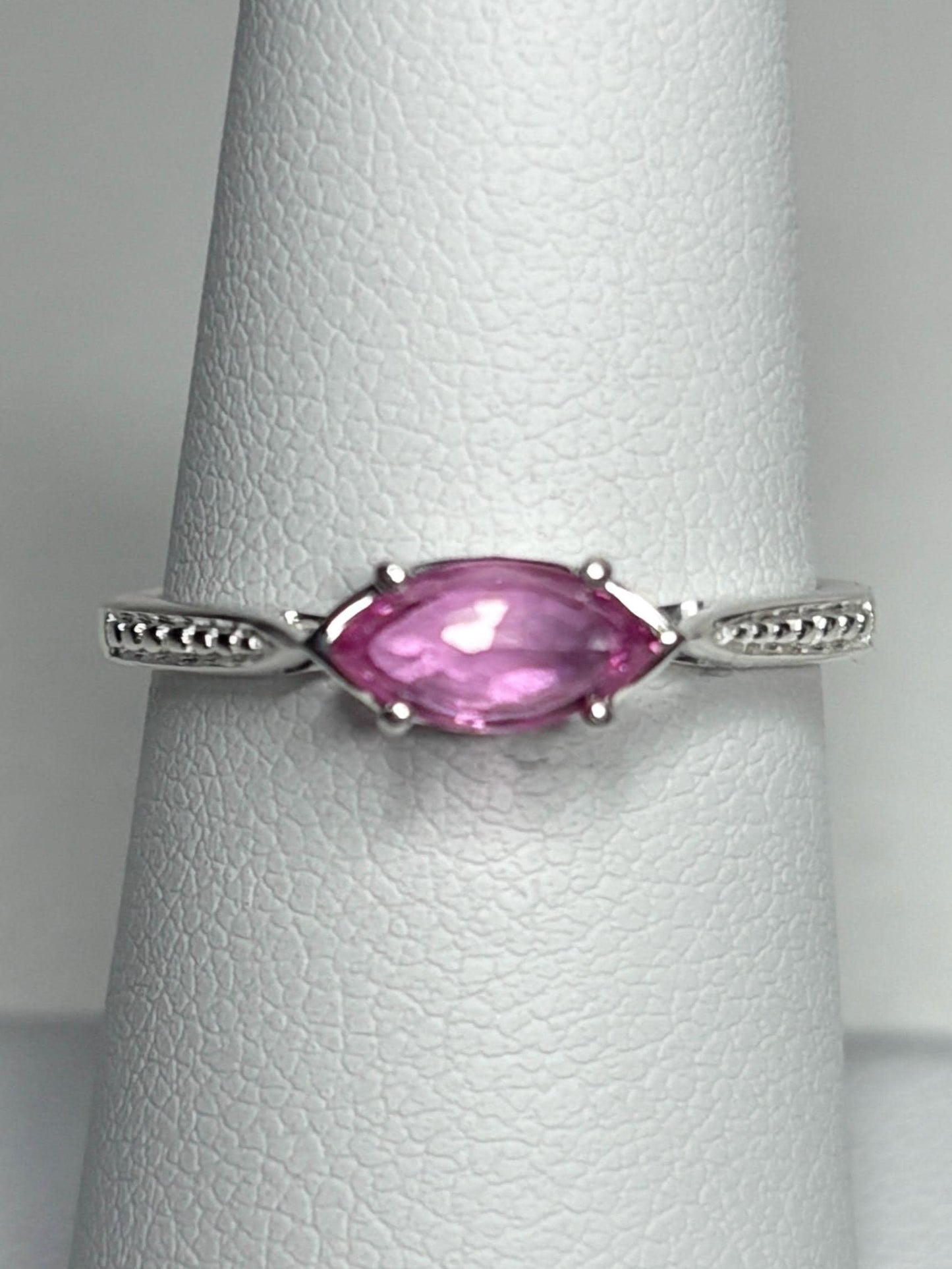 Sterling silver ring with a rose-cut marquise pink sapphire set east-west.