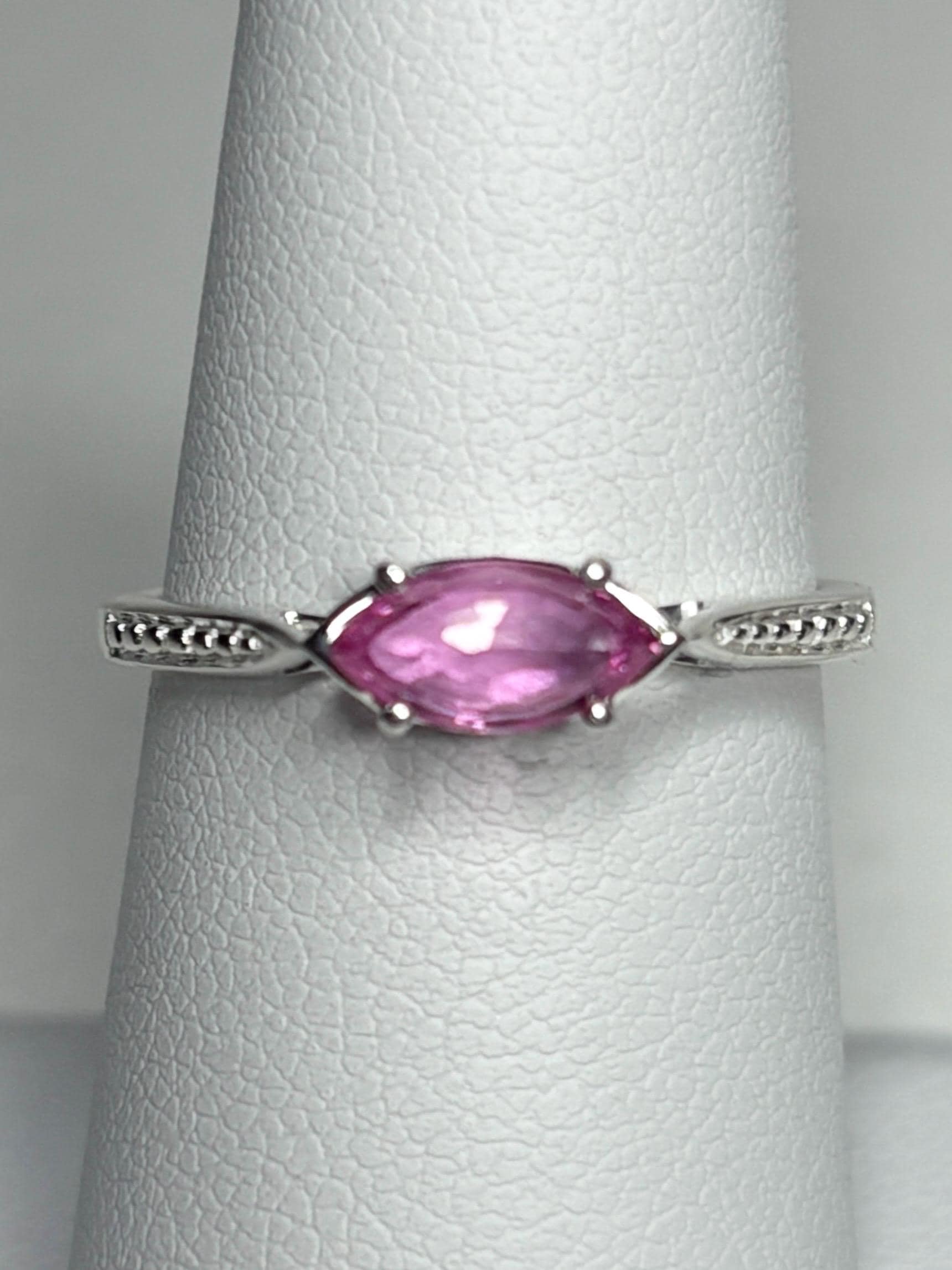 Sterling silver ring with a rose-cut marquise pink sapphire set east-west.