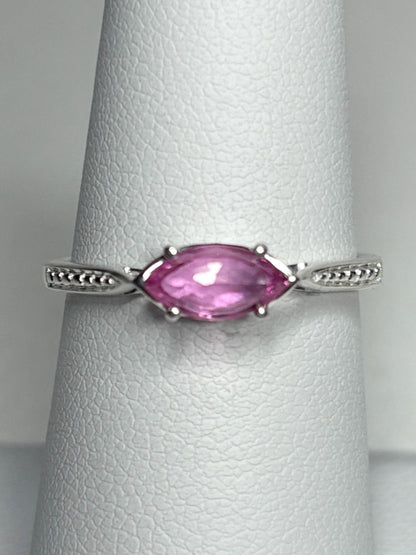 Sterling silver ring with a rose-cut marquise pink sapphire set east-west.
