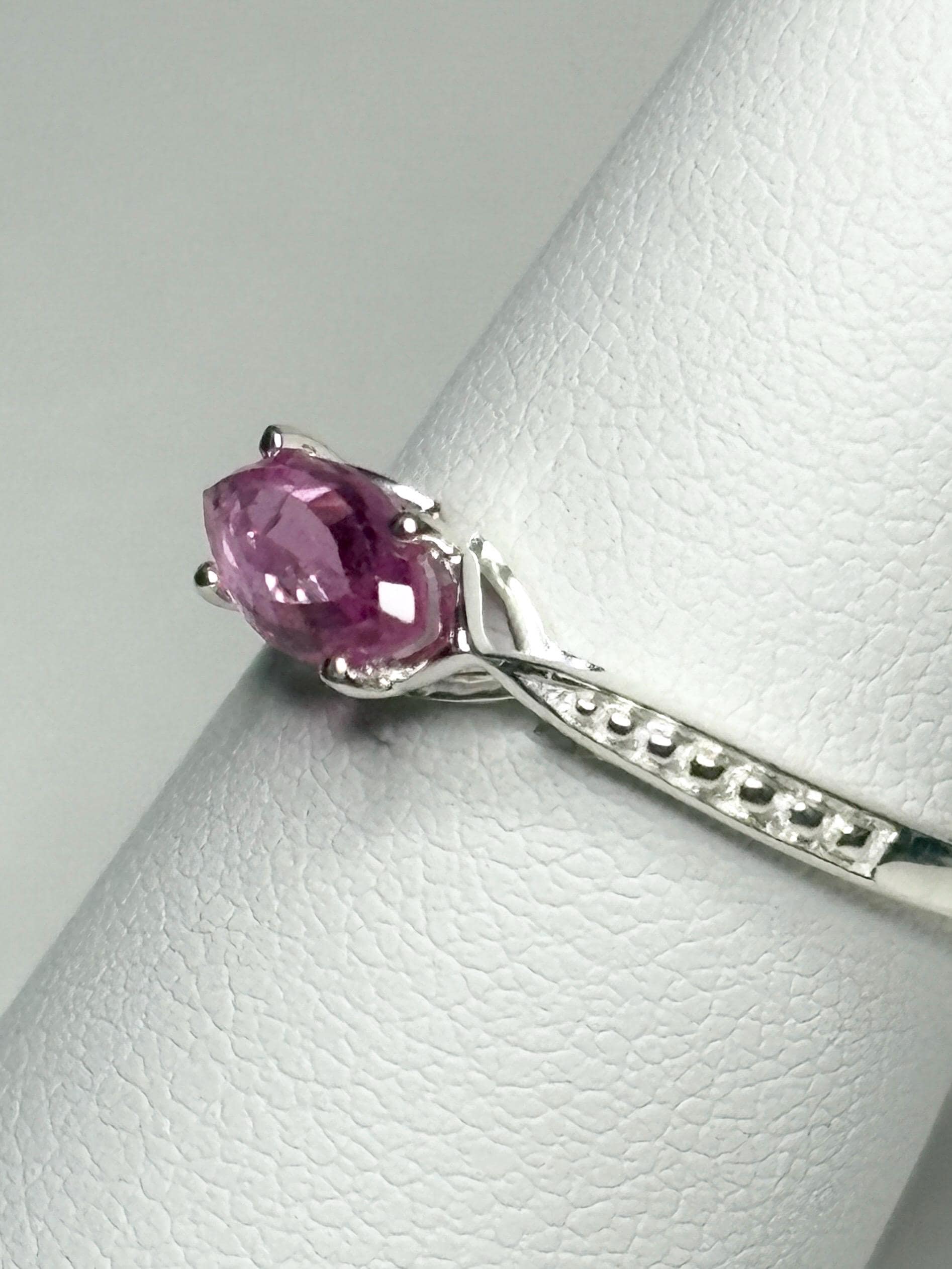Sterling silver ring with a rose-cut, east-west set marquise pink sapphire.