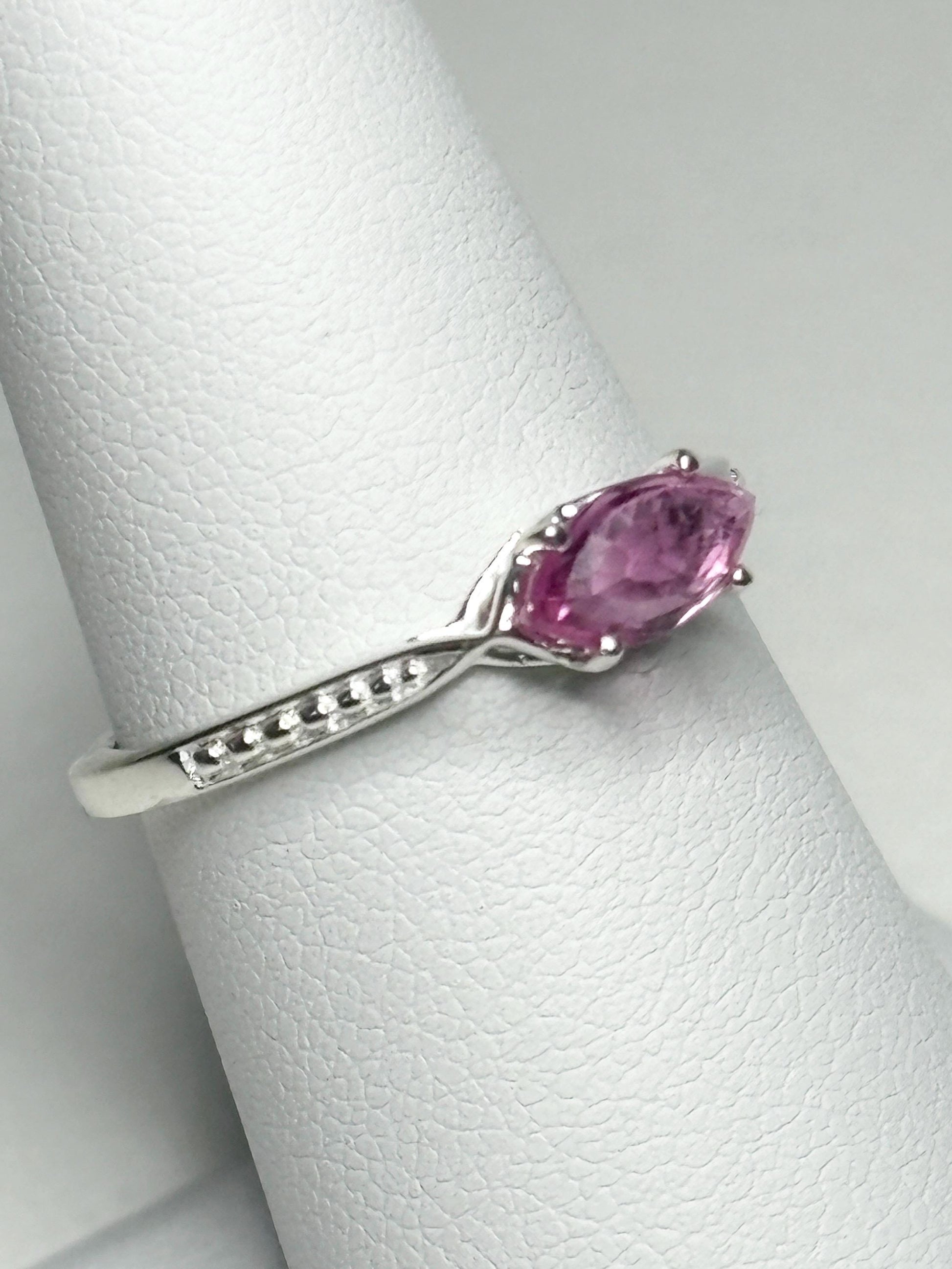 Sterling silver ring with a rose-cut marquise pink sapphire set east-west.