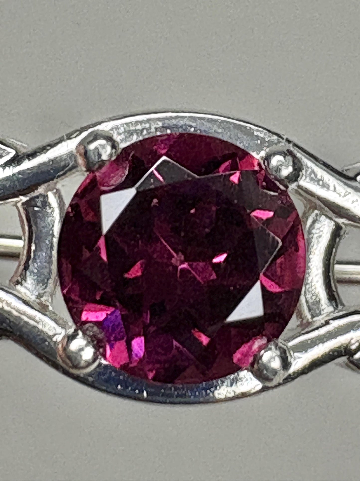 Rhodolite garnet Celtic knot brooch in sterling silver.